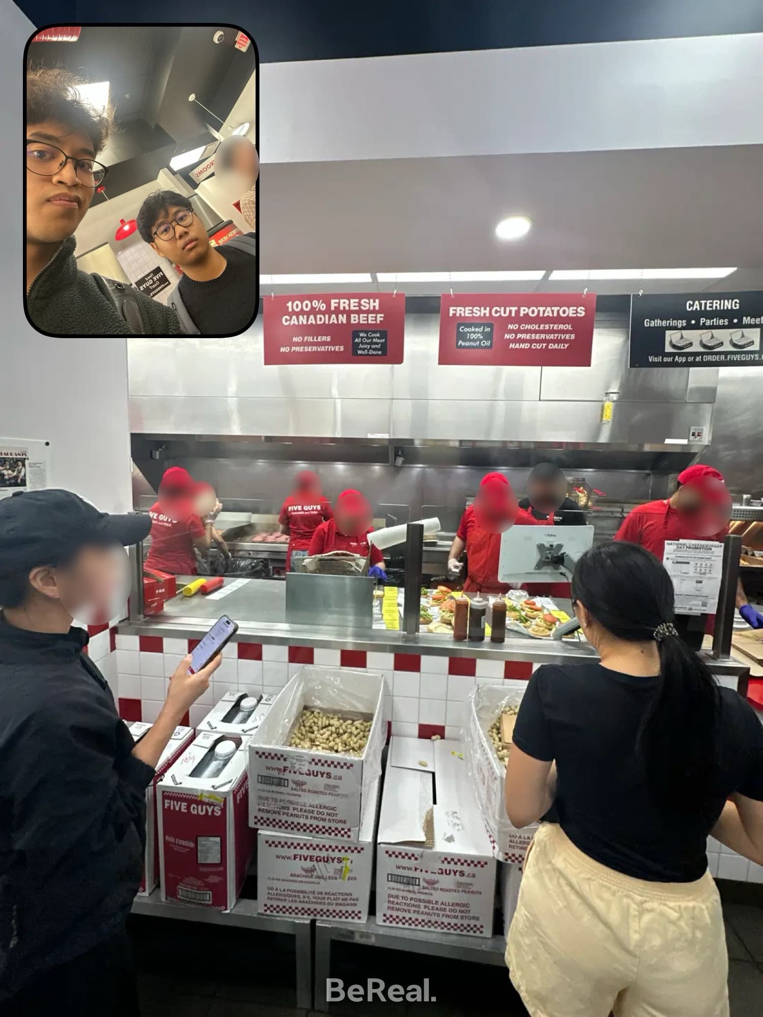 Me and a friend in line at Five Guys on National Burger Day.